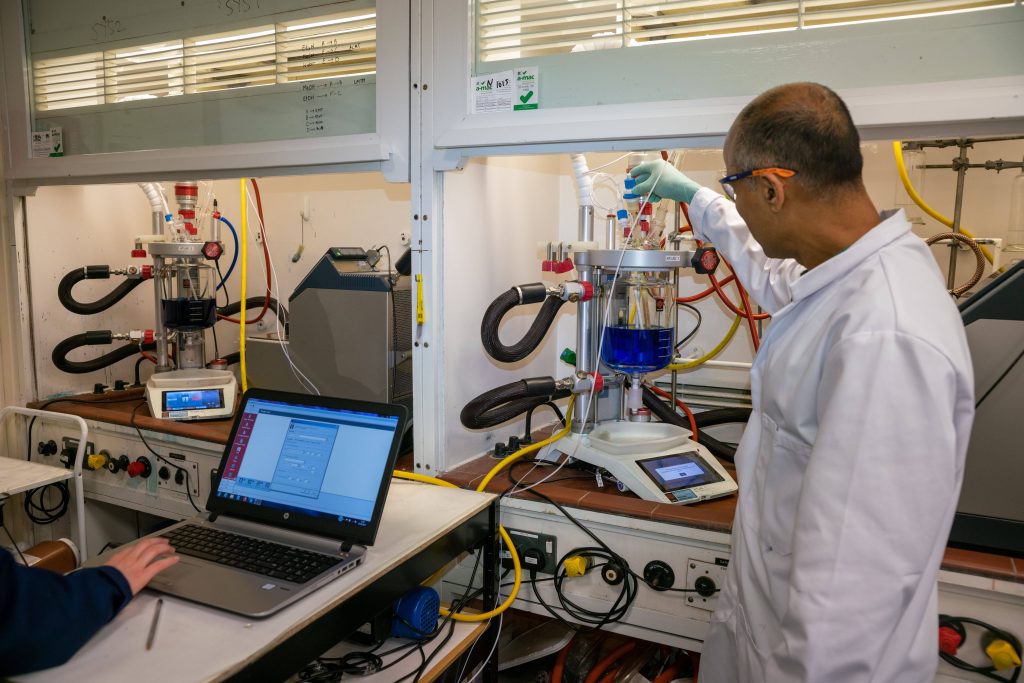 A picture of TauRX's lab showcasing the Atlas HD systems and Atlas Syringe Pumps - Walk-away API process development for TauRX with Syrris Atlas HD